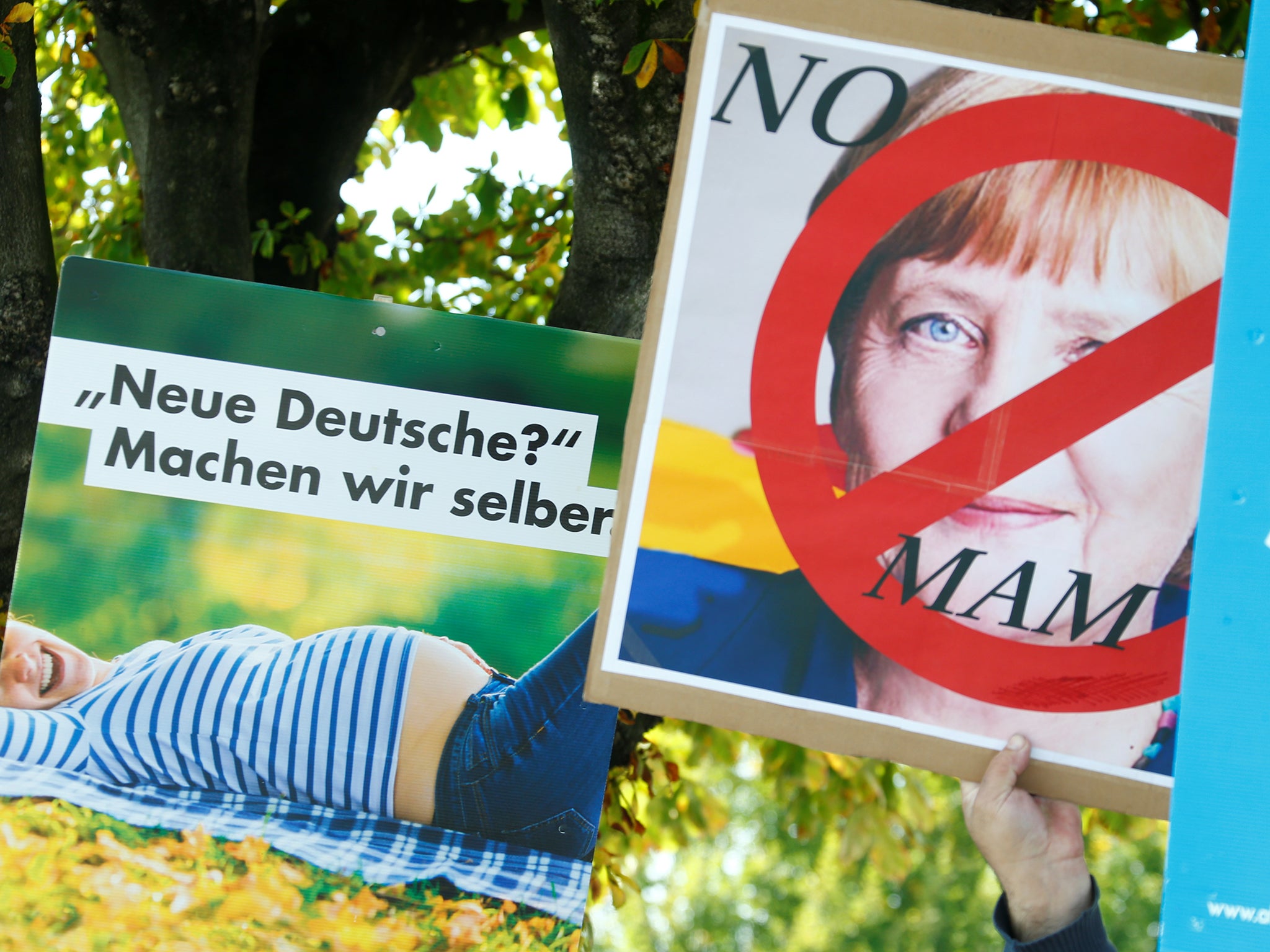 AfD supporters brandished placards against Angela Merkel in Heppenheim