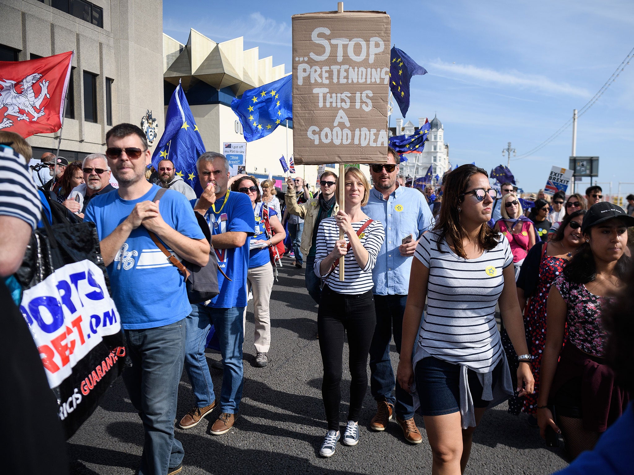 Pro-EU demonstrators march outside the main venue on the first day of the Labour Party conference