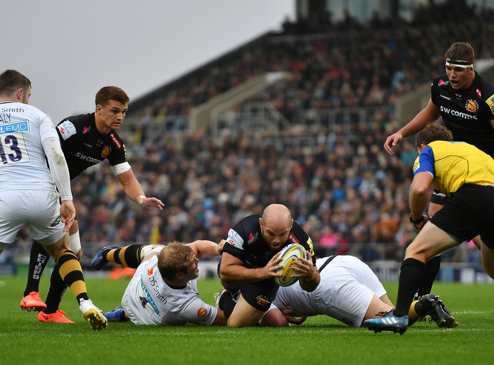 Shaun Malton of Exeter dives over to score his side's fourth try