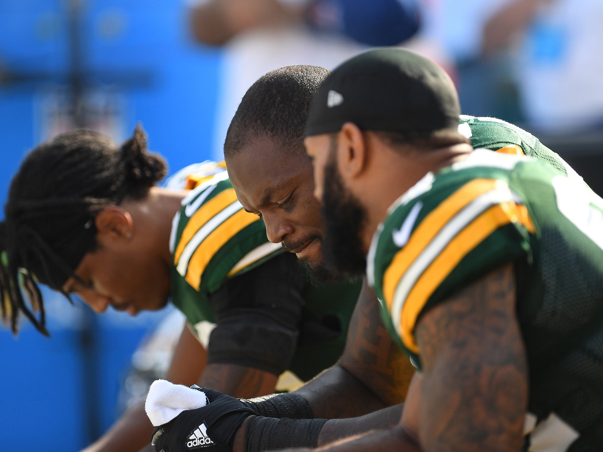 Green Bay Packers players sat down during the national anthem