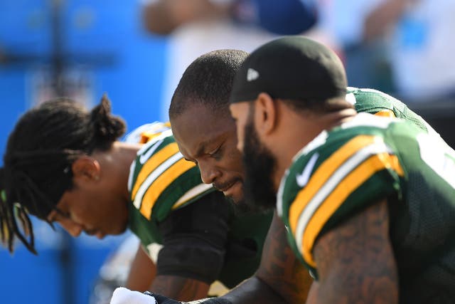 Green Bay Packers players sat down during the national anthem
