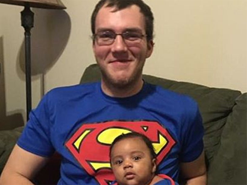 Church usher Robert Engle, in picture with unidentified baby, is being treated for a “significant” head injury he suffered in the scuffle