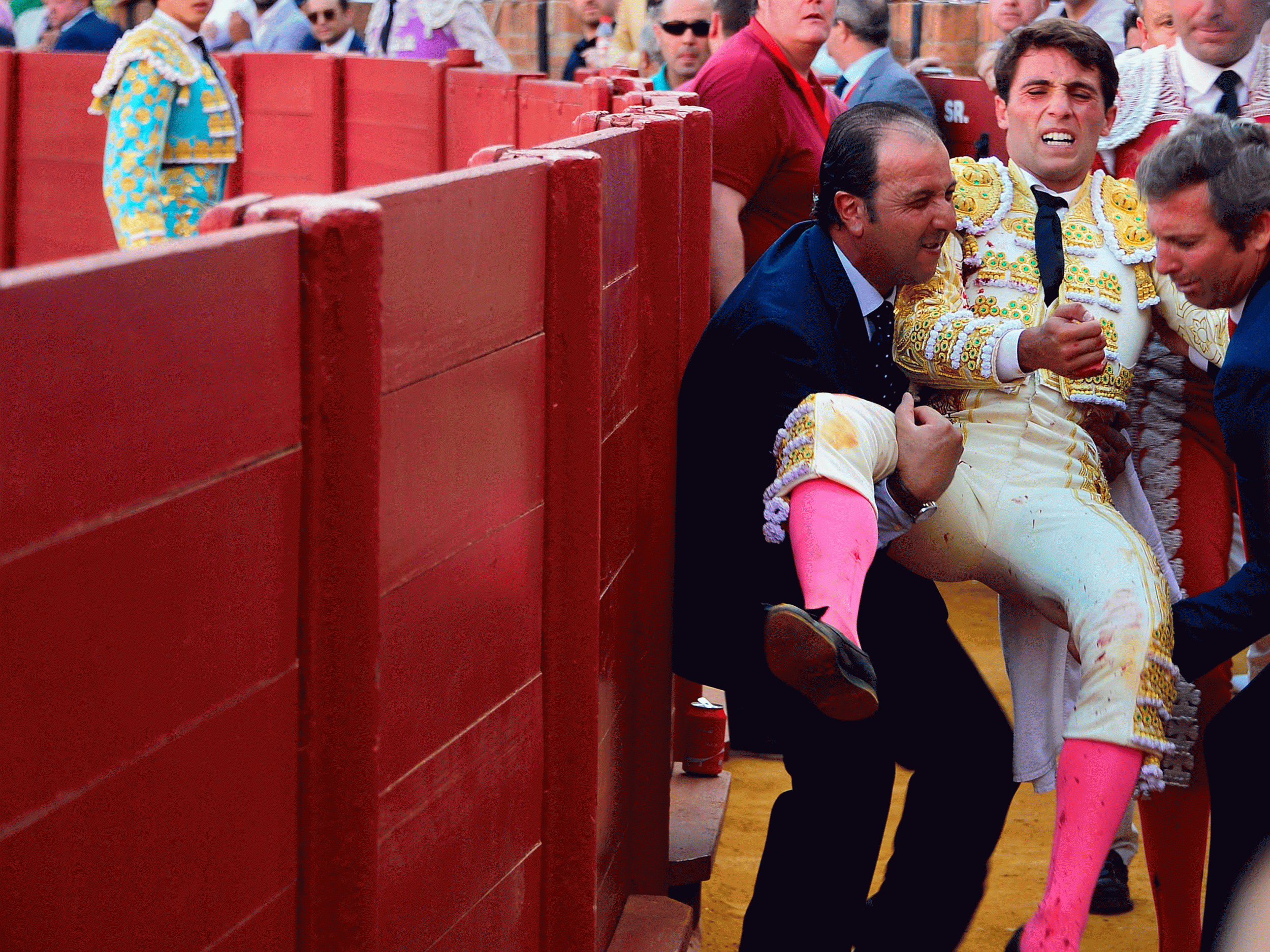 Spanish matador Rafael Serna (2ndR) is evacuated after being gored by a bull