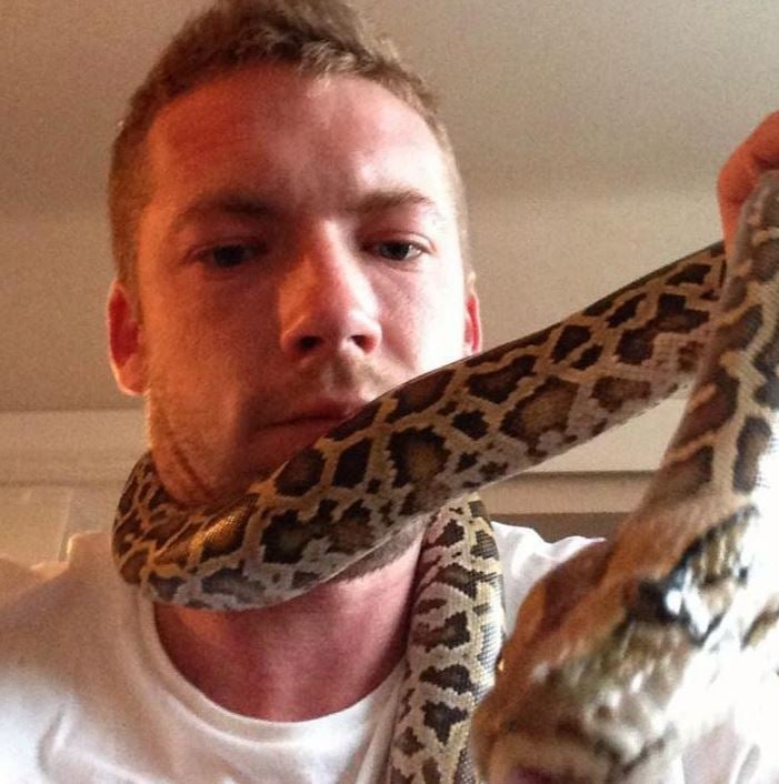 Dan Brandon with a snake wrapped around his neck (Dan Brandon/Facebook )