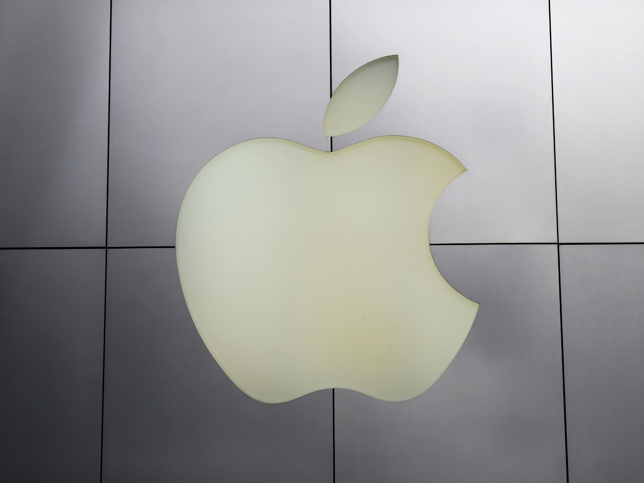 The Apple logo is pictured at its flagship retail store in San Francisco, California January 27, 2014