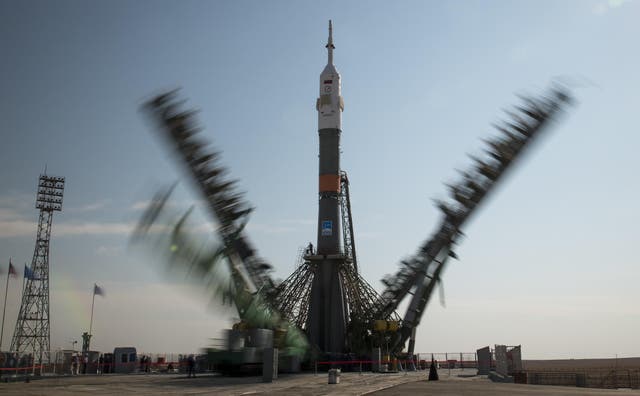The gantry arms of the Soyuz rocket are seen closing in this long exposure photograph at the Baikonur Cosmodrome, Kazakhstan, Sunday, Sept. 10, 2017