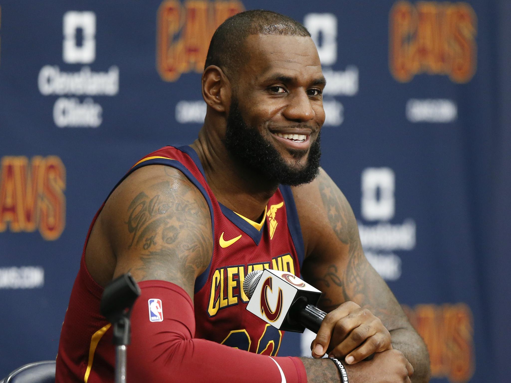 Cleveland Cavaliers' LeBron James answers questions during the NBA basketball team media day on 25 September in Ohio.