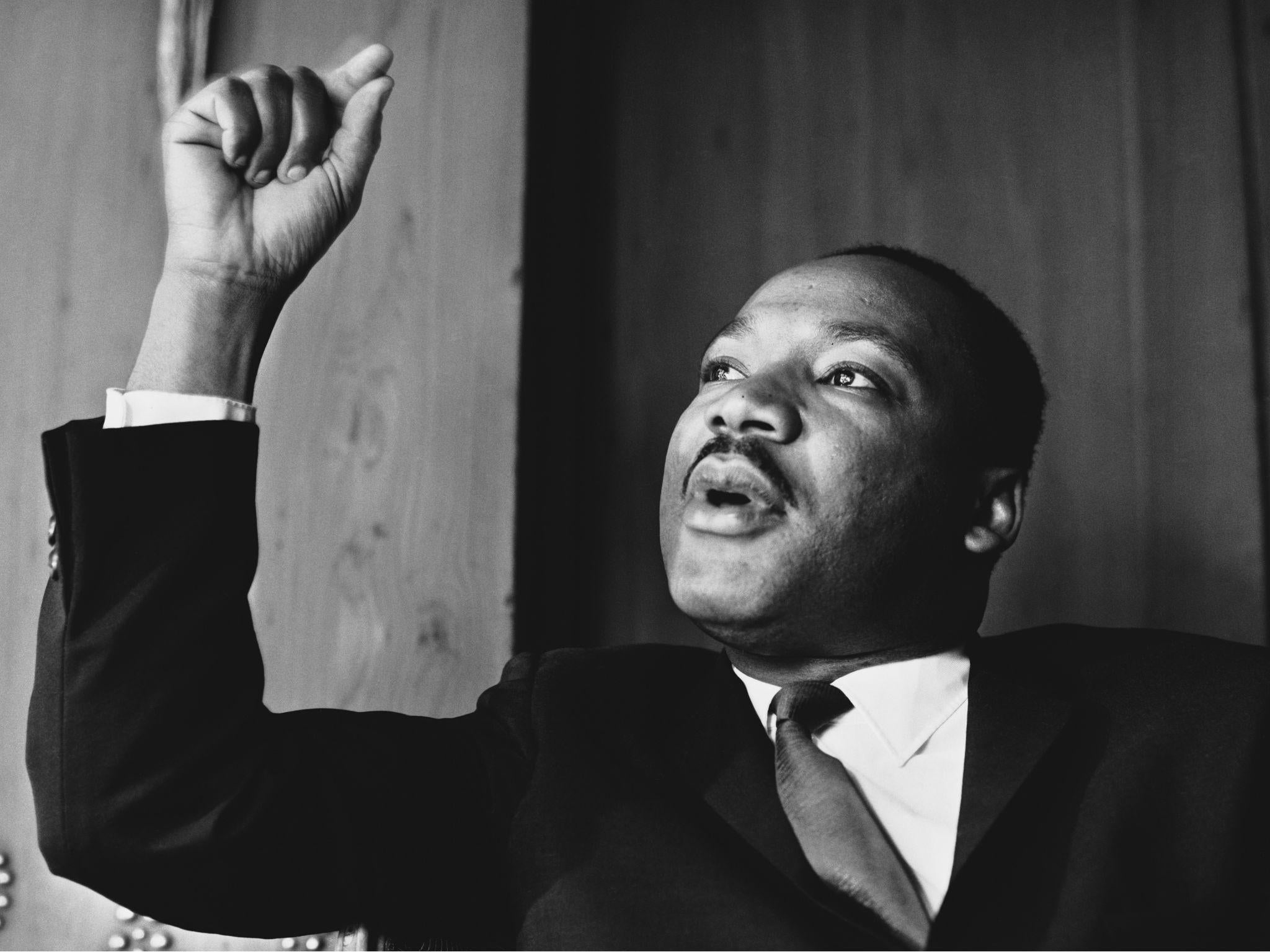 American civil rights leader Martin Luther King, Jr at a press conference in London, September 1964