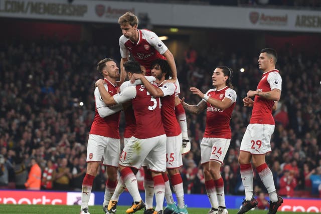 Arsenal's players celebrate with Alexandre Lacazette after his second goal