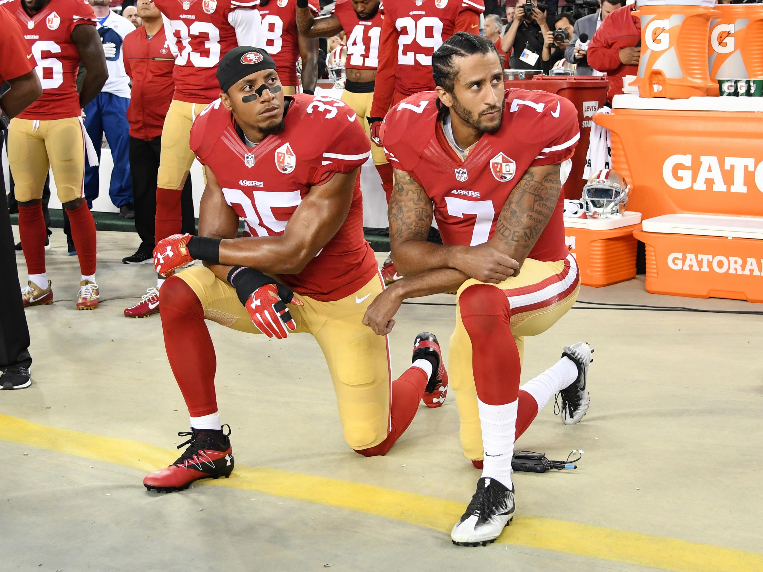 Eric Reid (left) kneels in protest during national anthem next to Colin Kaepernick in 2016