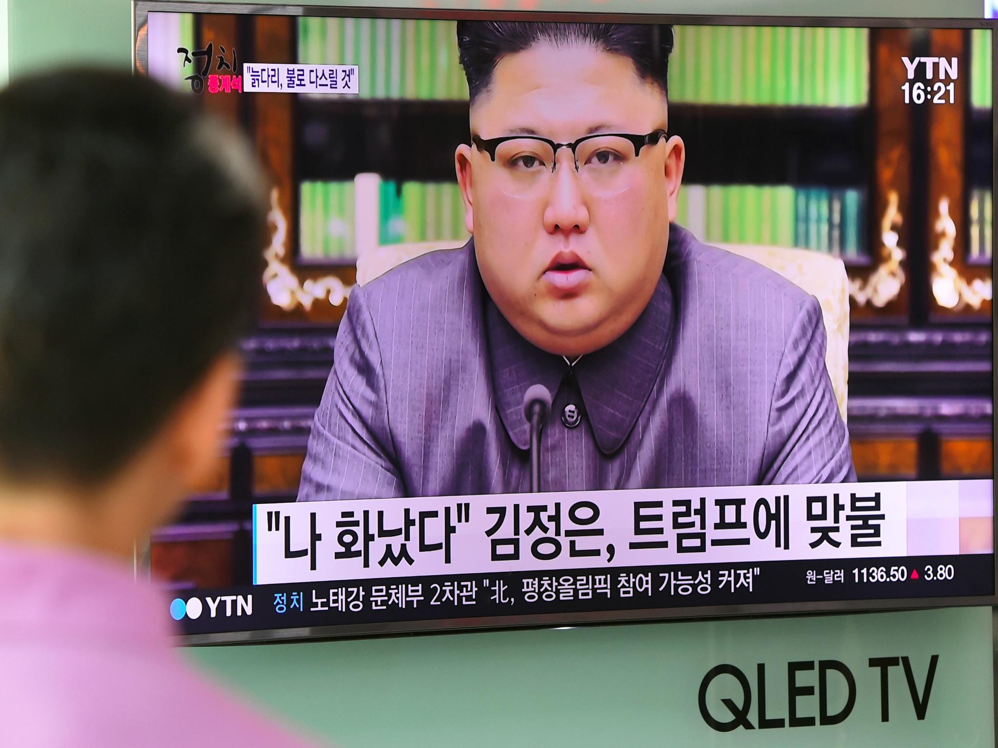 A man watches a television news screen showing a picture of North Korean leader Kim Jong-Un delivering a statement in Pyongyang, at a railway station in Seoul on 22 September 2017.