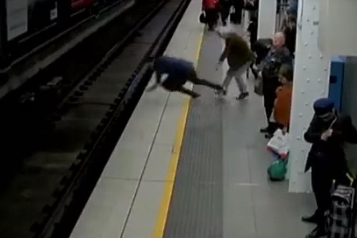 Man faints onto subway tracks and gets pulled to safety just as train enters station