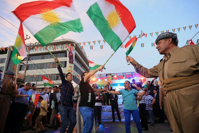 Kurds celebrate to show their support for the independence referendum in Duhok, Iraq