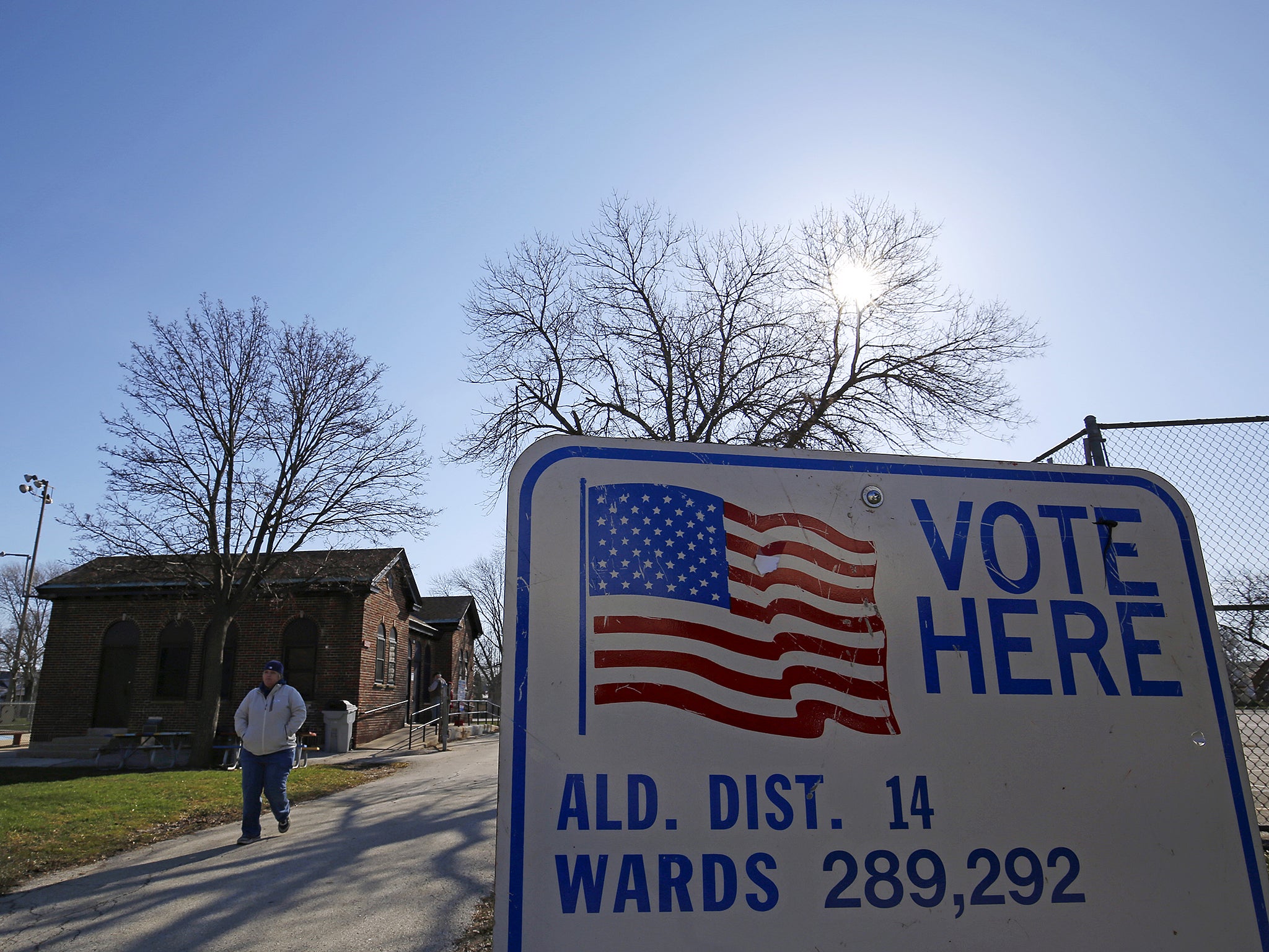 A voter walks away from a polling station after casting their ballot in Wisconsin