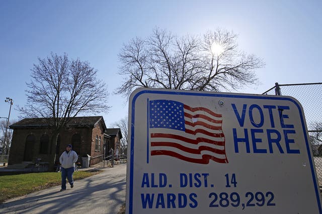 A voter walks away from a polling station after casting their ballot in Wisconsin