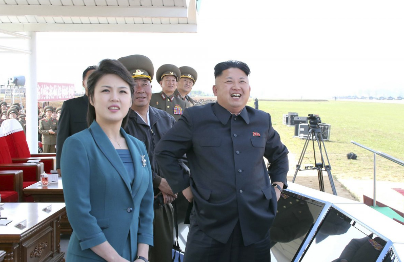Mr Kim and wife Ms Ri attend the 2014 Combat Flight Contest among commanding officers of the Korean People's Air Force