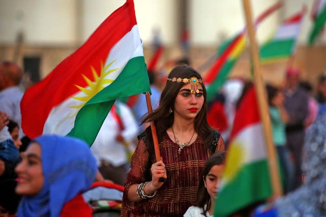 Kurds in the northeastern Syrian city of Qamishli turn out on September 26, 2017 to support the independence referendum in Iraq's autonomous northern Kurdish region