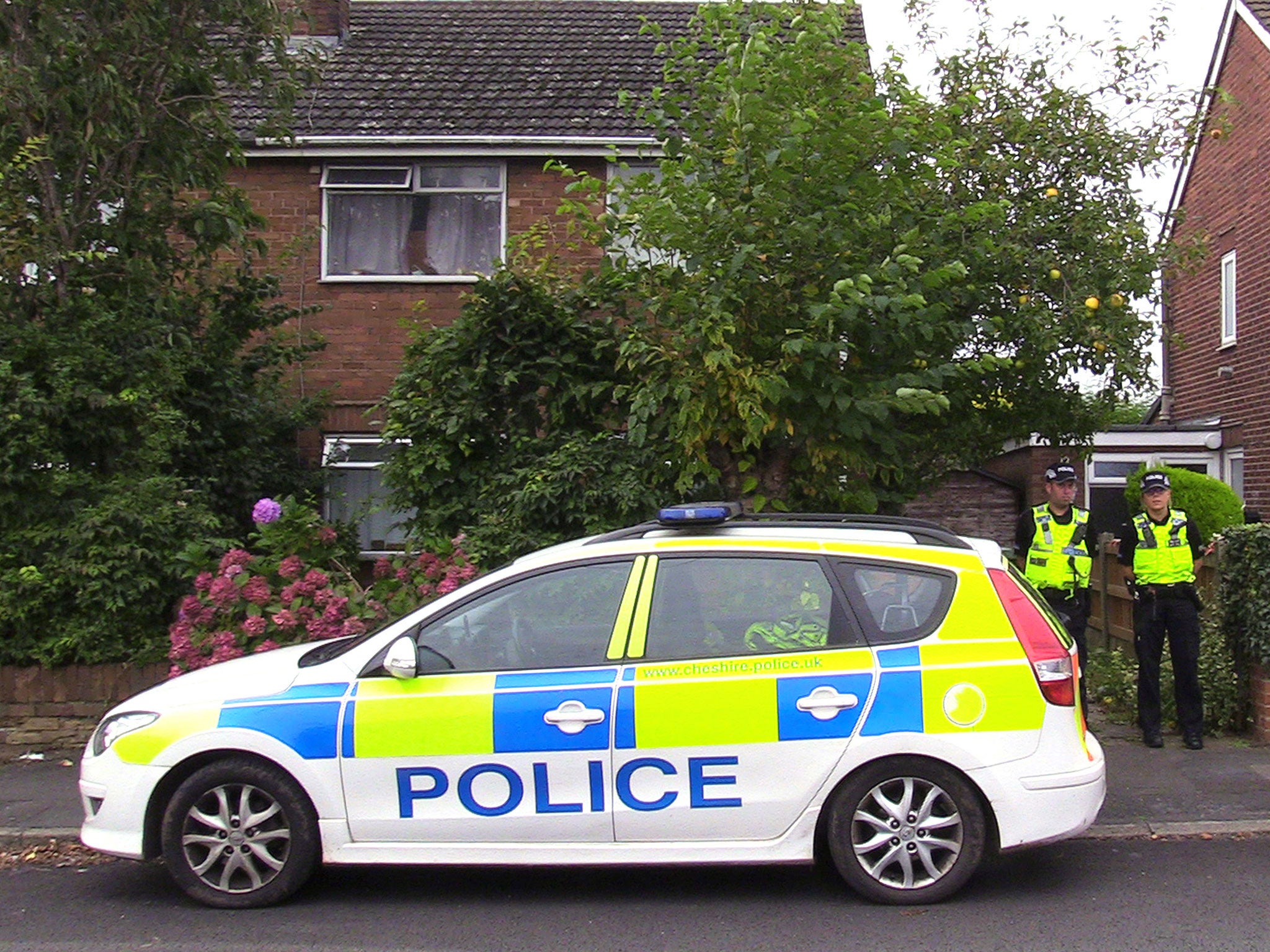 Police at the scene in Greymist Avenue in Warrington, Cheshire, following a police counter-terrorism raid where a 31-year-old man was arrested