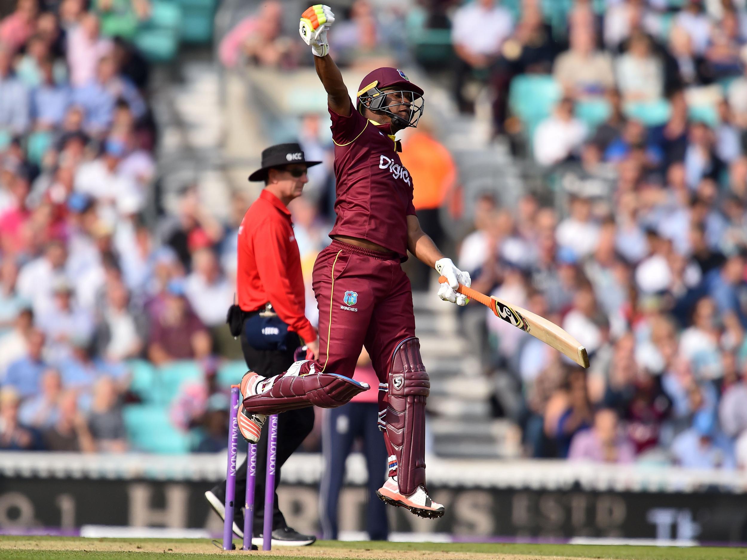 Evin Lewis celebrates bringing up his century