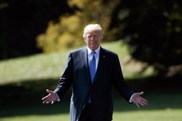 President Donald Trump walks to speak to reporters as he walks to board Marine One on the South Lawn of the White House