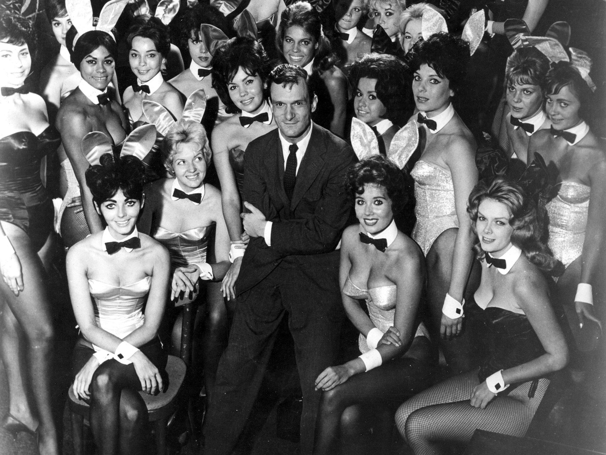 Hugh Hefner poses with Playboy Bunnies at one of America's chain of Playboy clubs in 1962, a year before Ms Steinem went undercover