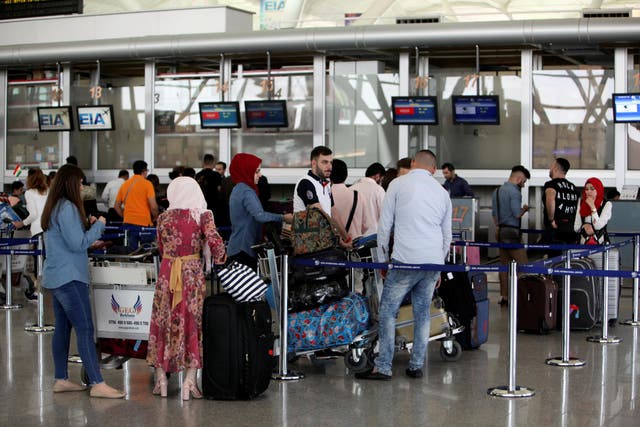 Passengers queue at the check-in counters at Irbil International Airport in Iraq on 27 September 2017