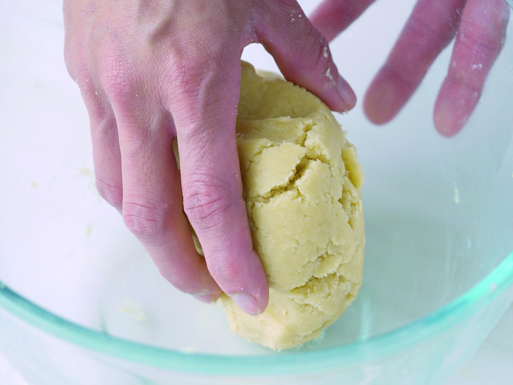 8. Pull the pastry together with your hands, shaping it into a flat disc, about 10cm in diametre and 1.5cm thick. Do this as quickly as possible, without overworking the pastry, which also makes it tough