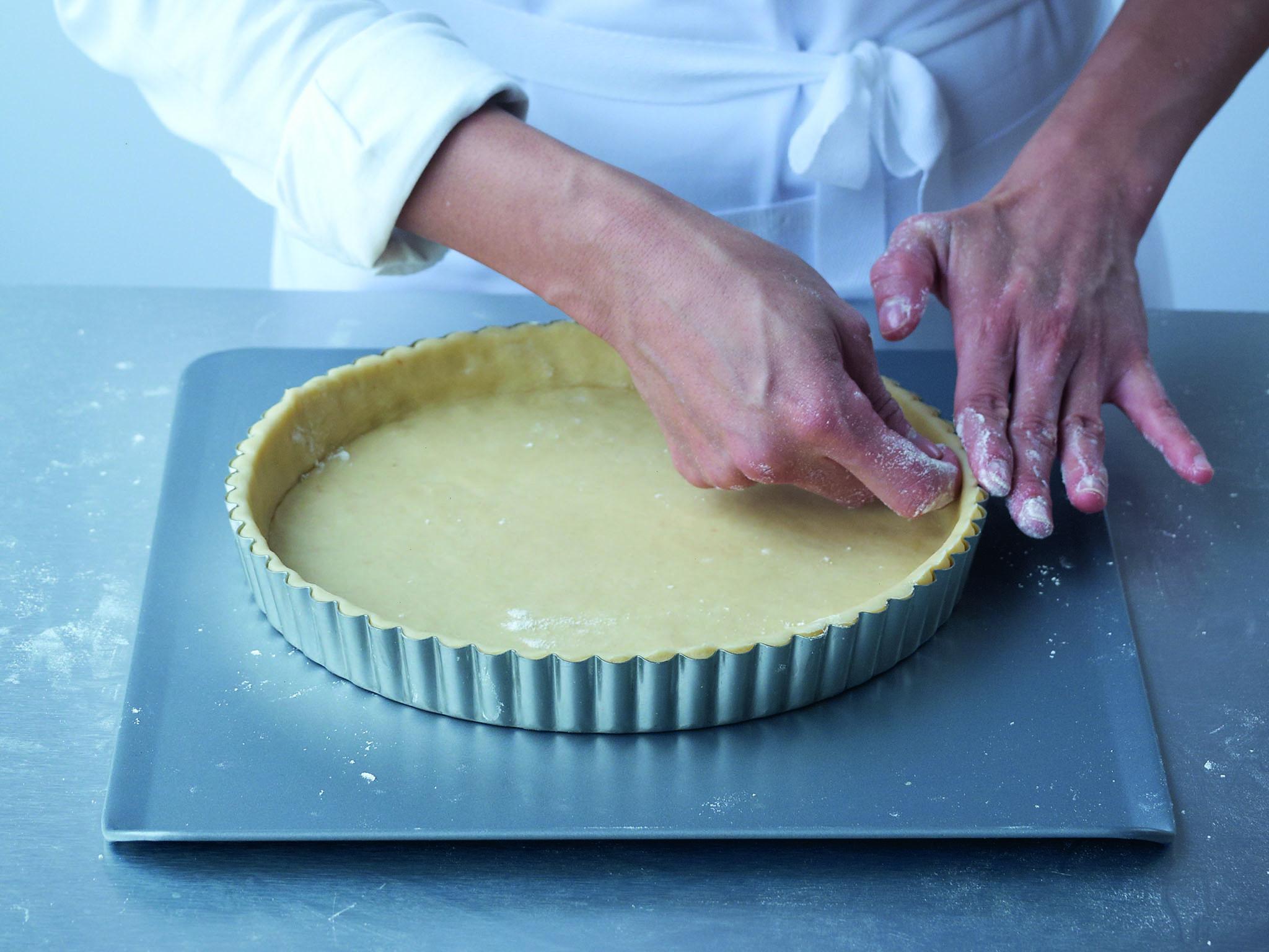 6. Working your way around the edge with your thumbnail, release the pastry a little from the flan tin or ring, then neaten and smooth the top rim of pastry. Cover the pastry closely with cling film and chill until ready to use