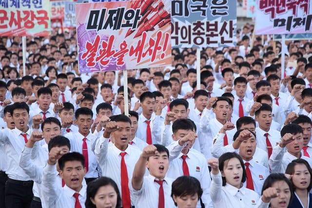 An anti-US rally at Kim Il Sung Square in Pyongyang on September 24. Placards read: 'Be through with the US' and 'The US is evil's headquarters'