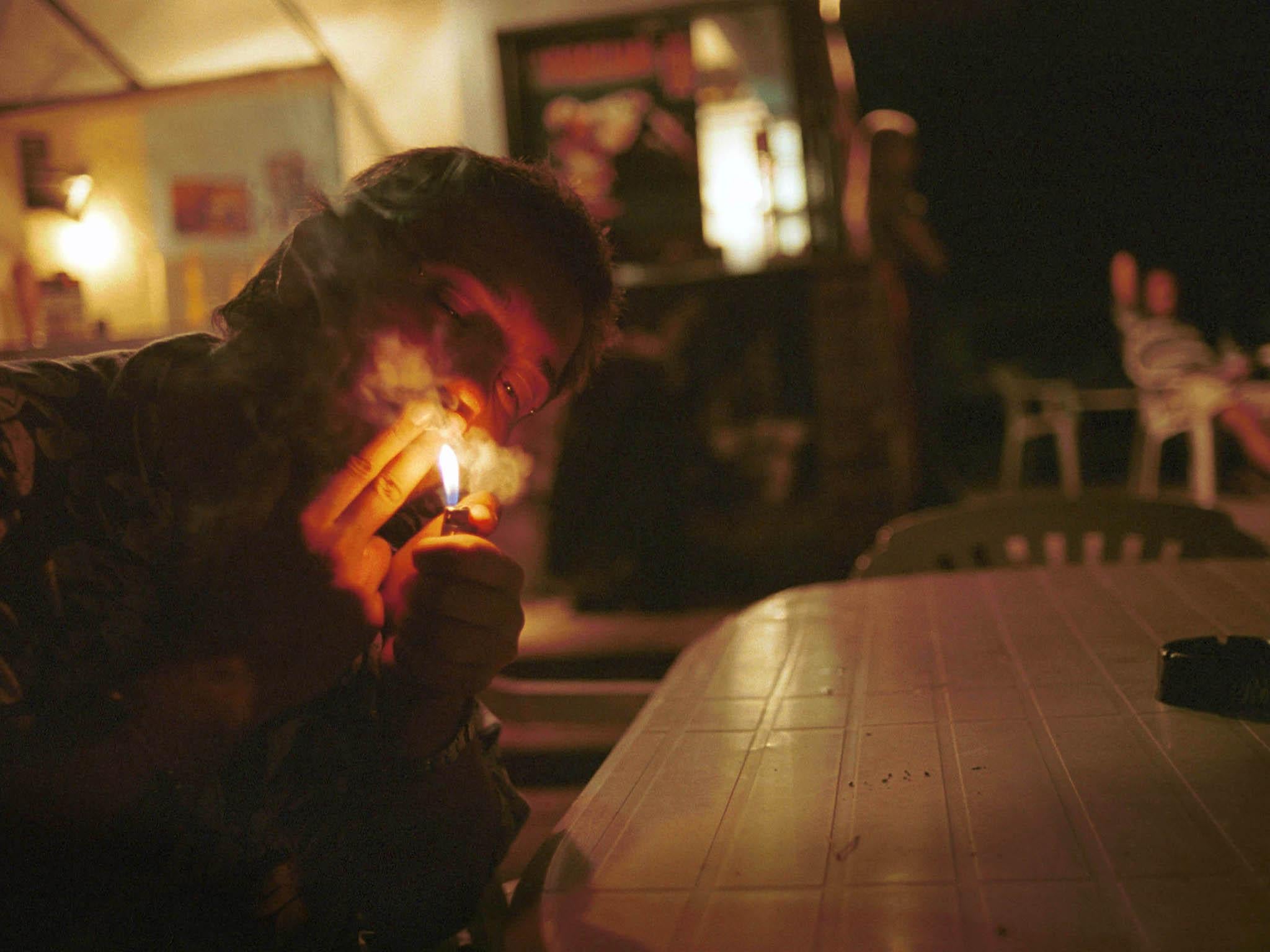 A student smokes marijuana at a café in Sofia, Bulgaria. Smoking in public is not uncommon in the nation’s capital