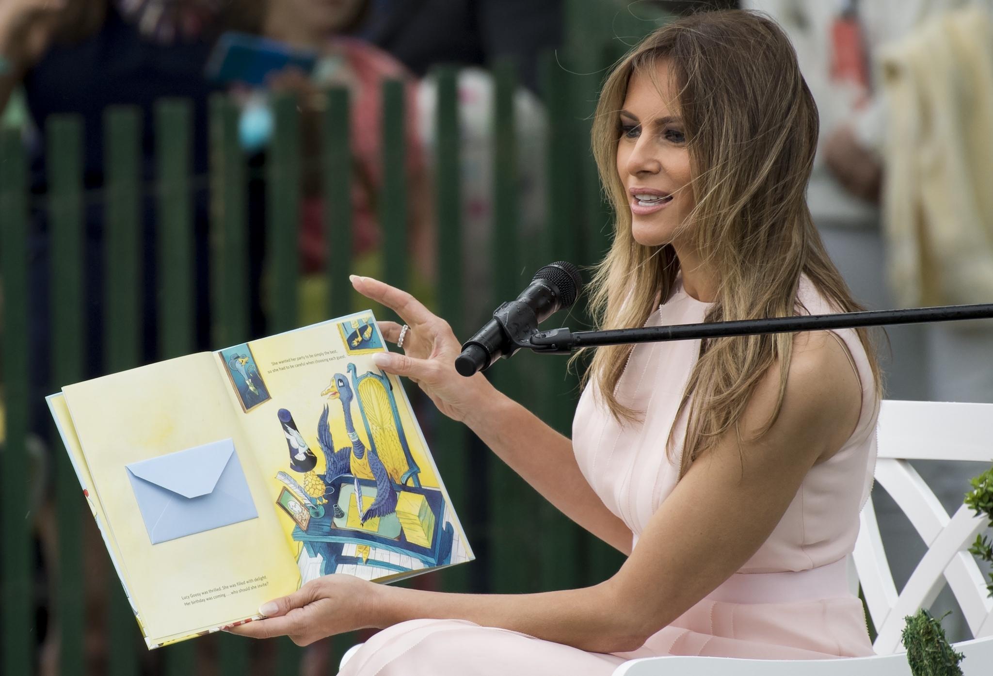 irst Lady Melania Trump reads a book during the 139th White House Easter Egg Roll