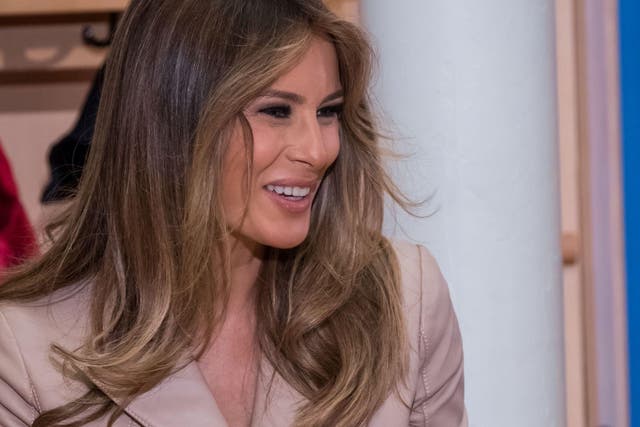 US First Lady Melania Trump offer presents as she visits the Queen Fabiola children's hospital, on the sidelines of the NATO (North Atlantic Treaty Organization) summit