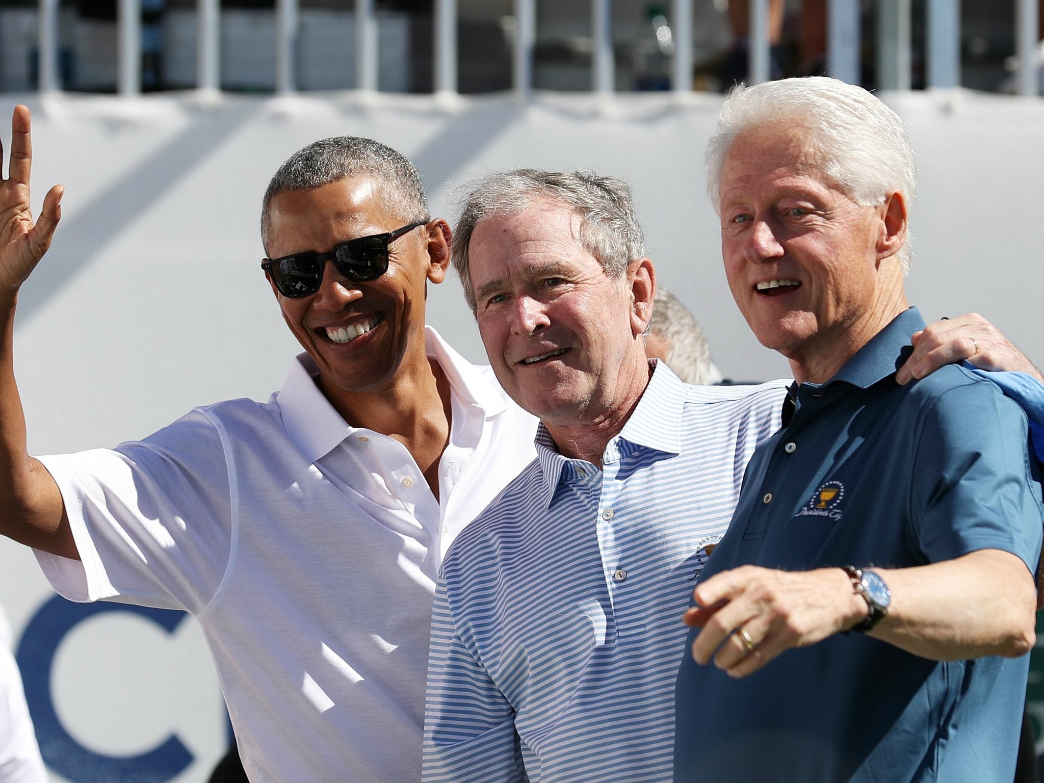 Former US Presidents Barack Obama, George W. Bush, and Bill Clinton attend the Presidents Cup at Liberty National Golf Club on 28 September Jersey City, New Jersey.