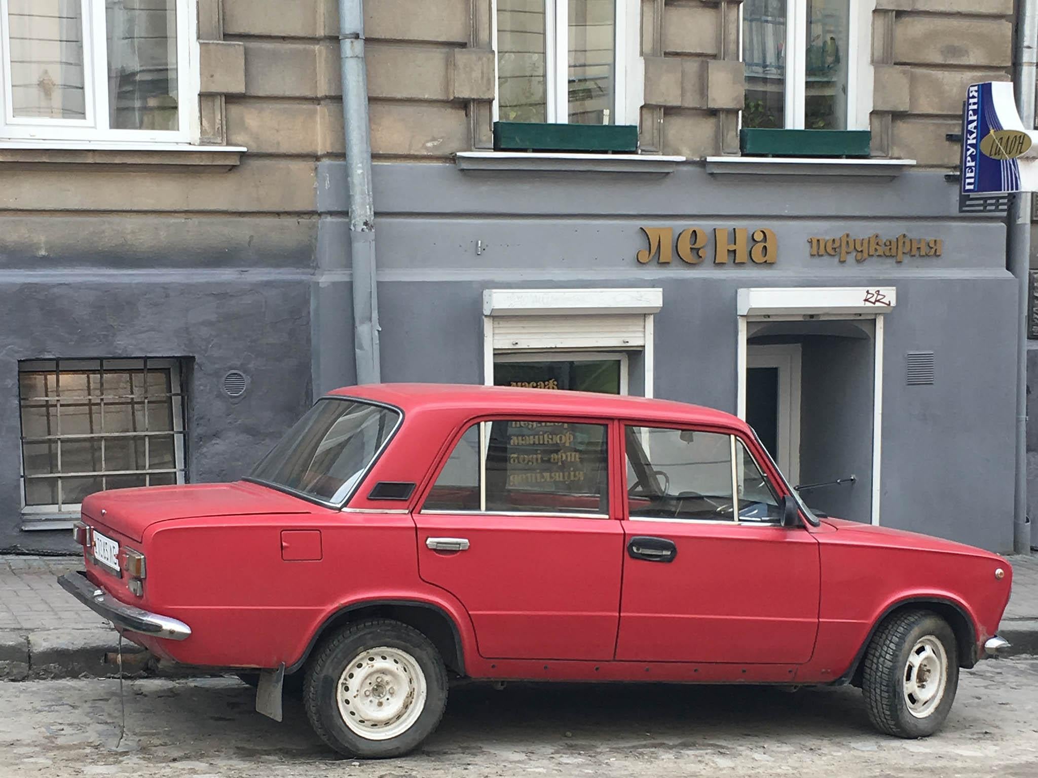 The old Russian Lada cars are dotted around the cobbled streets