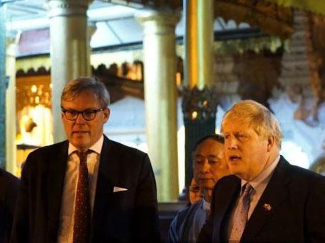 British ambassador to Burma, Andrew Patrick, moves to stop Boris Johnson reciting the poem