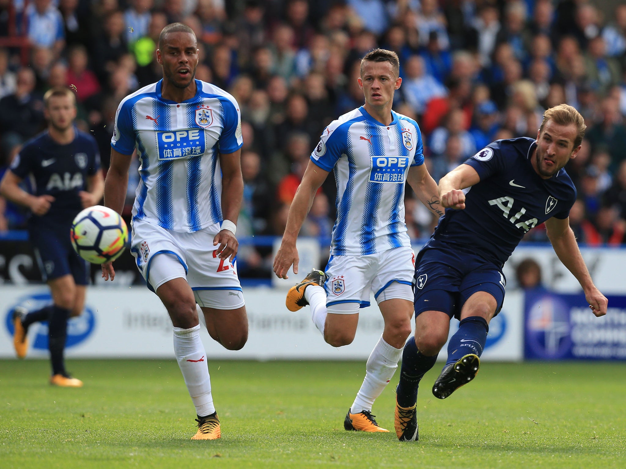 Kane curls the ball in from long range to score his second