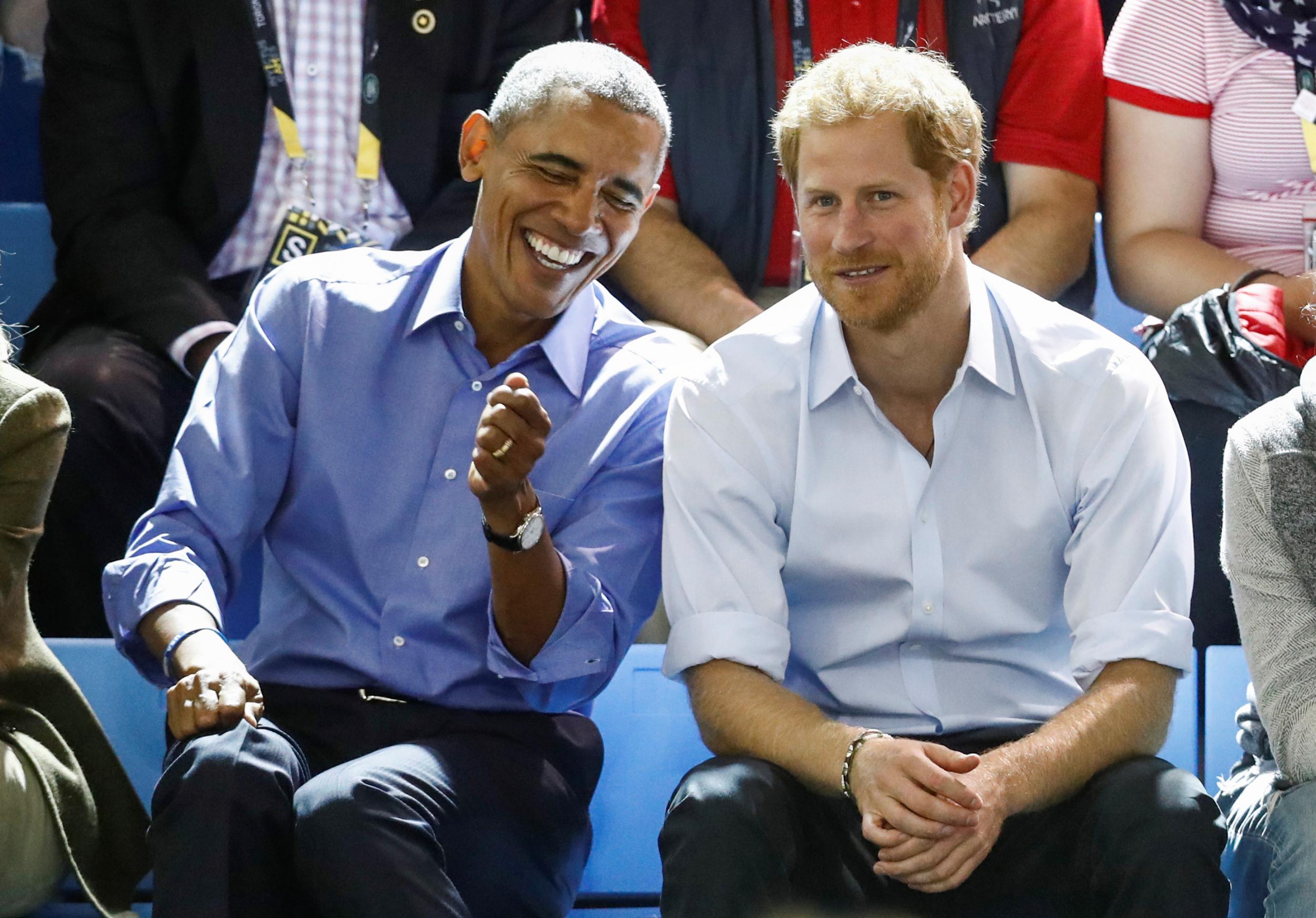Barack Obama and Prince Harry share a joke during the Invictus Games