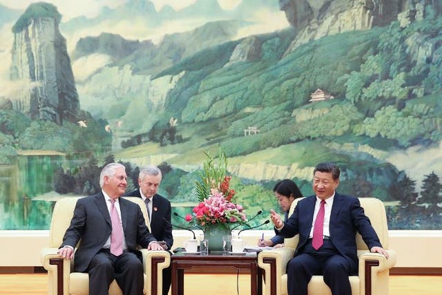 US Secretary of State Rex Tillerson (L) meets with Chinese President Xi Jinping (R) at the Great Hall of the People in Beijing
