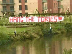 Fury as effigies hung from bridge on eve of Tory party conference