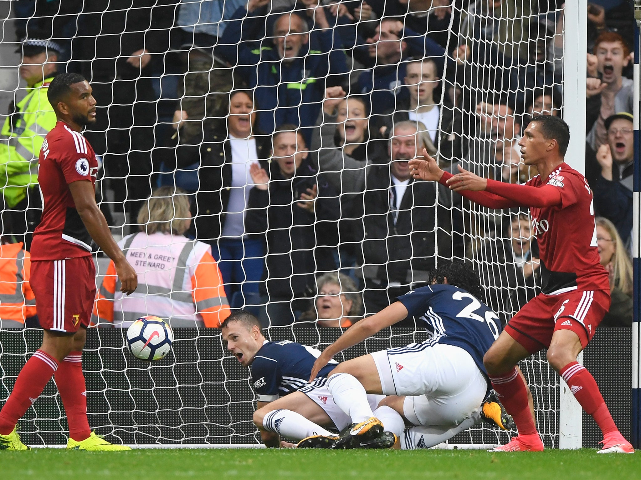 Jonny Evans bundles the ball over the line for West Brom's second