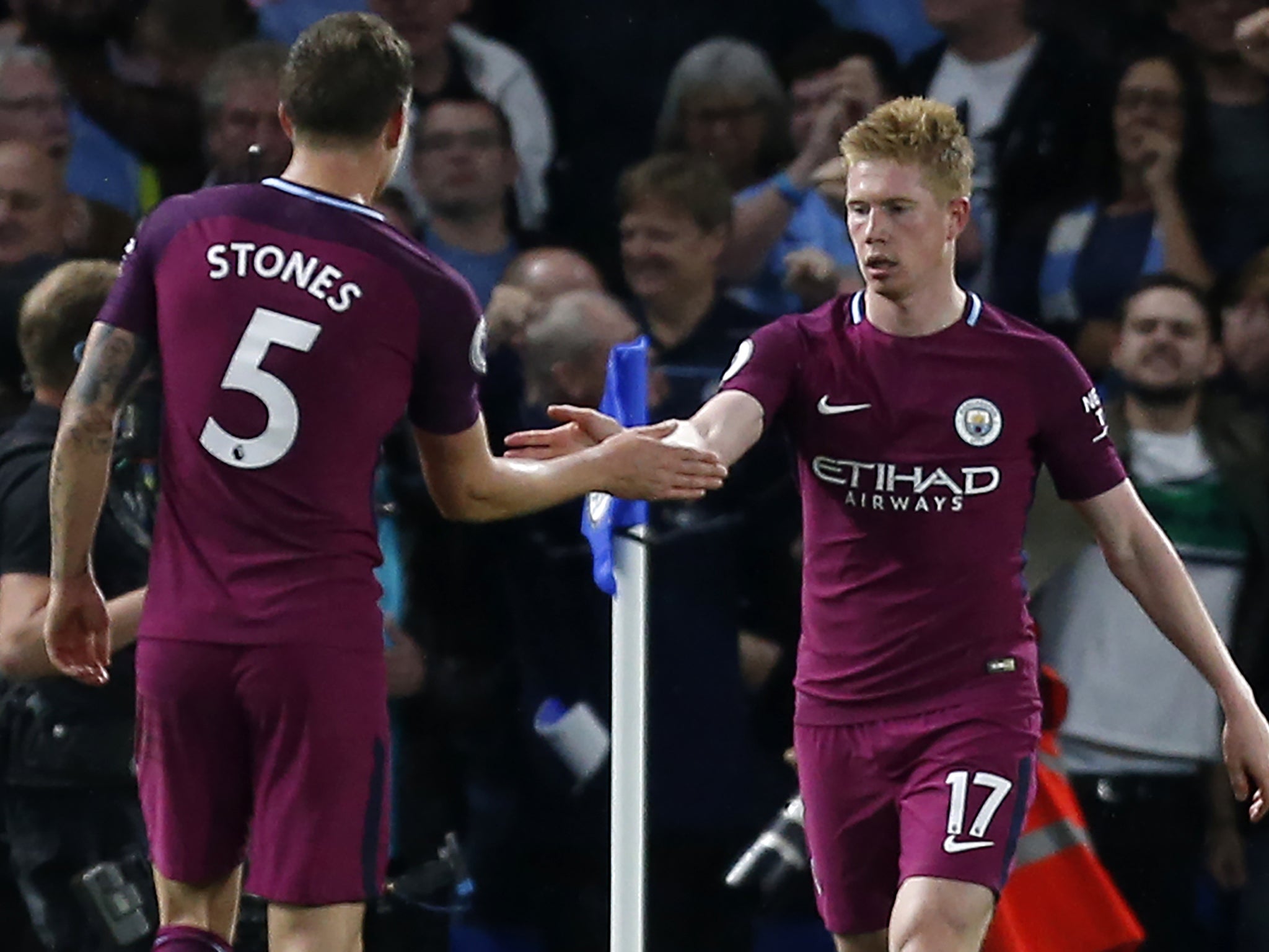 De Bruyne is congratulated by teammate John Stones
