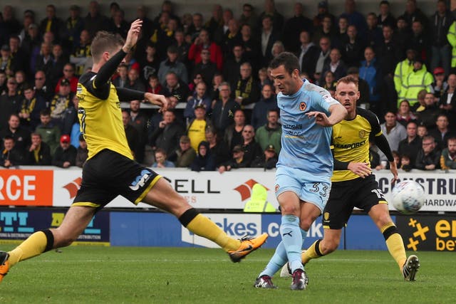 Leo Bonatini of Wolverhampton Wanderers scores the fourth goal to complete the rout of Burton Albion