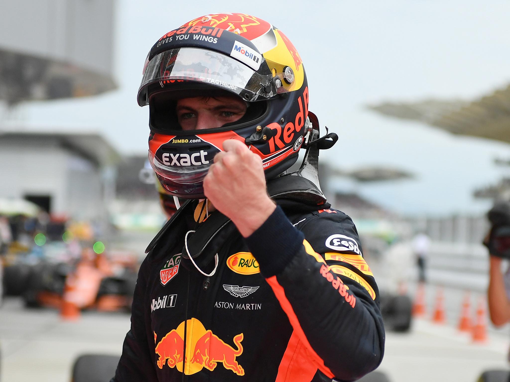 Max Verstappen celebrates winning the Malaysian Grand Prix with a dominant display