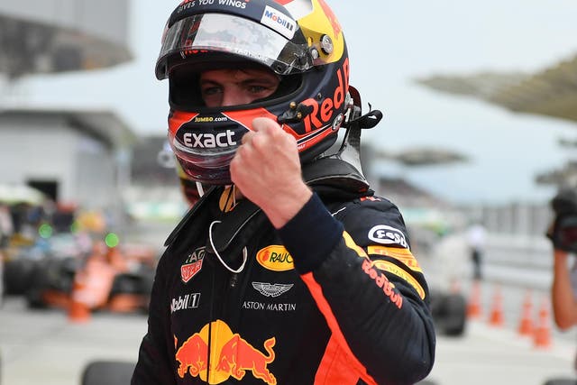 Max Verstappen celebrates winning the Malaysian Grand Prix with a dominant display