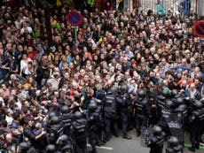 Hundreds injured as Spanish riot police try to stop Catalonia voters 