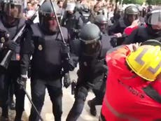 Catalan firefighters attacked by Spanish police as they shield voters