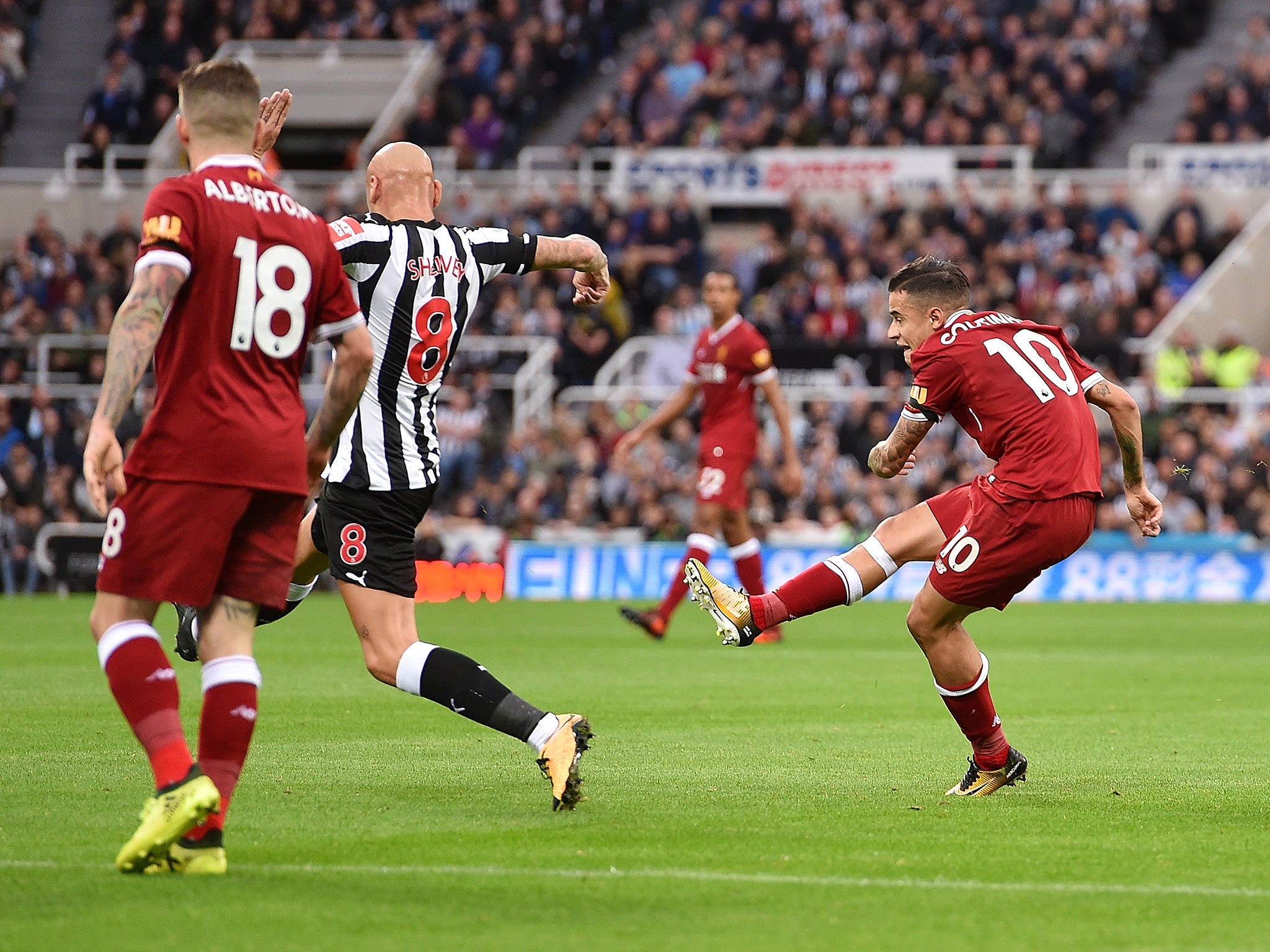 Philippe Coutinho curls in an effort to put Liverpool ahead