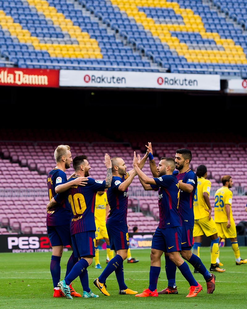 Barcelona celebrate Lionel Messi's goal in front of an empty Camp Nou