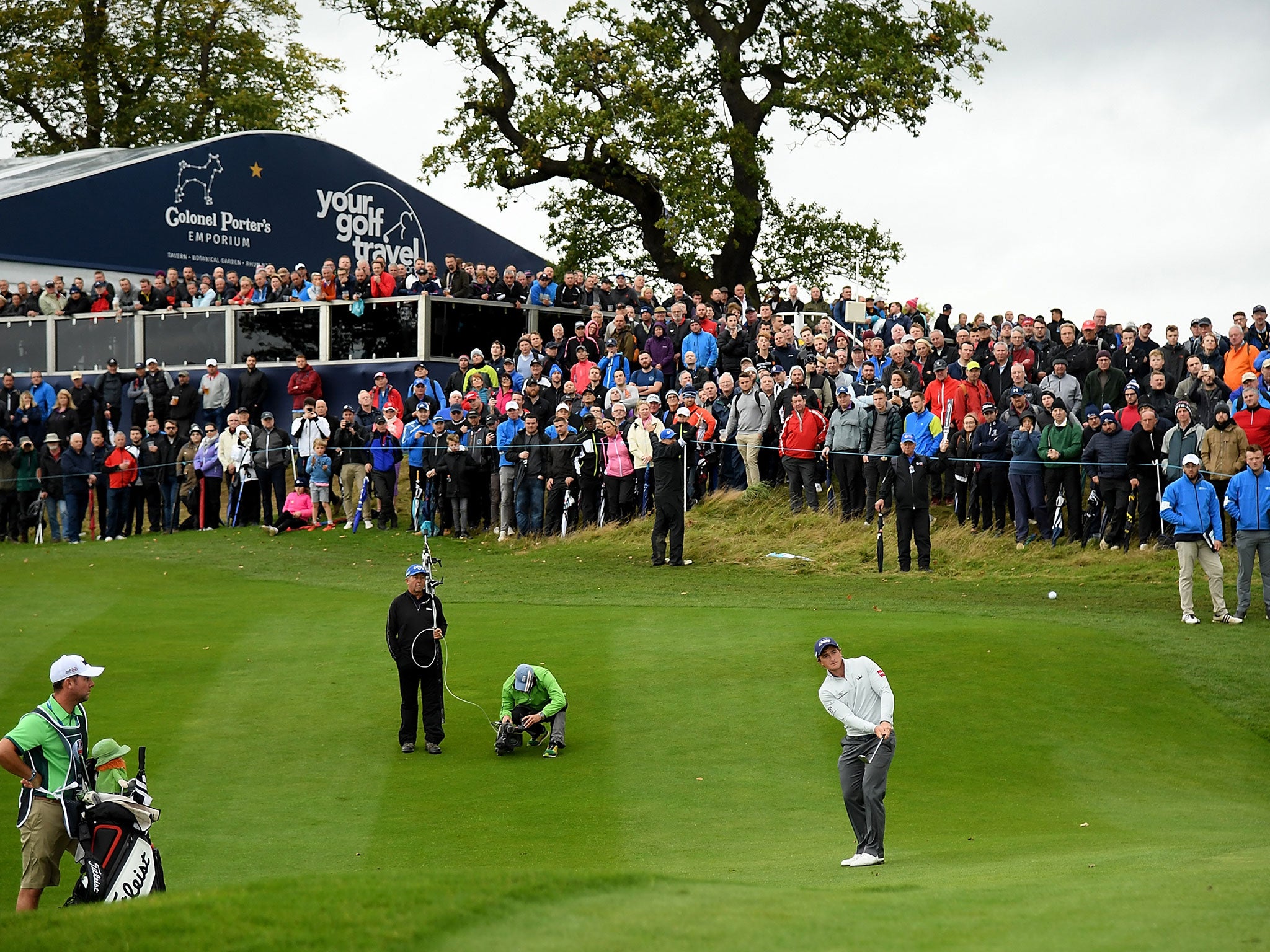 Dunne hits his second shot on the 17th hole