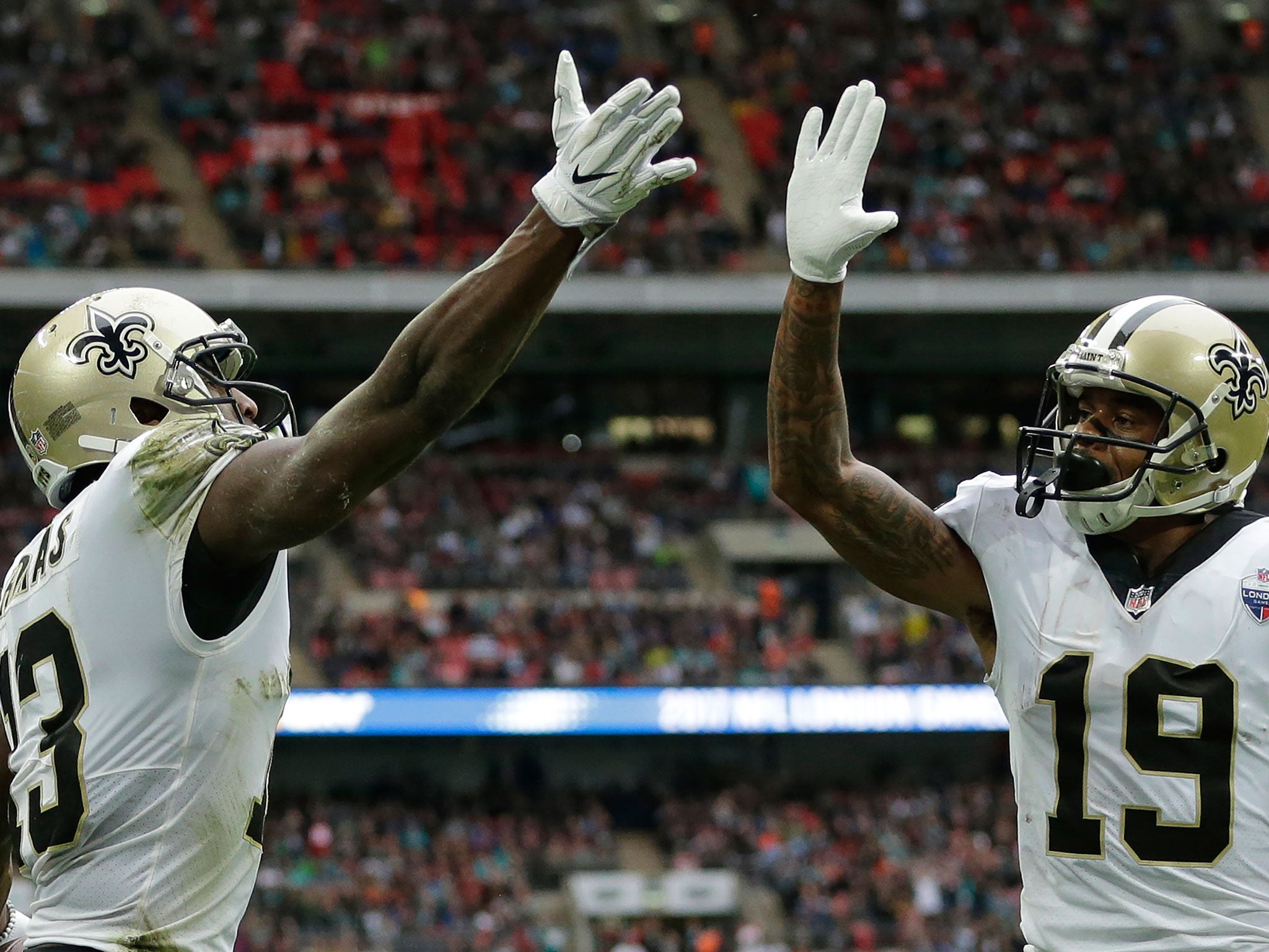 Michael Thomas celebrates with Ted Ginn Jnr after scoring the the New Orleans Saints' first touchdown